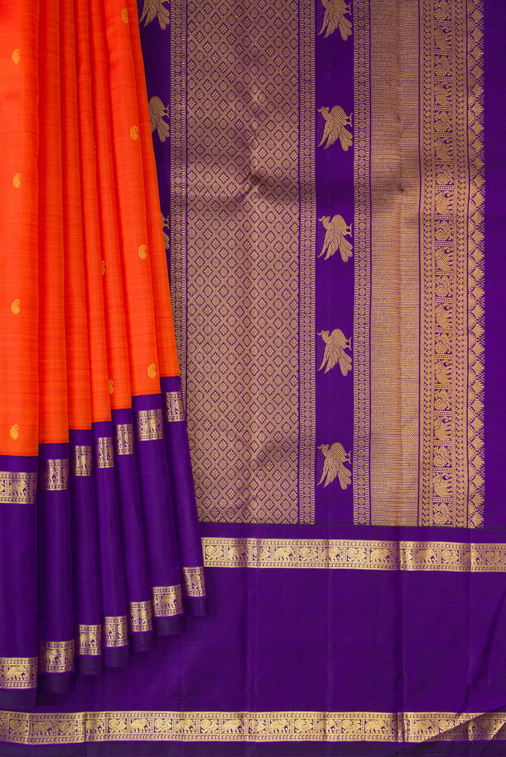 Pleats and pallu of Pure Silk Orange Kanchipuram Saree with Zari Butta on the body and Zari Border. 