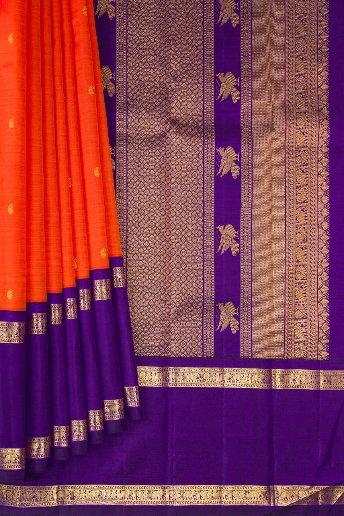 Pleats and pallu of Pure Silk Orange Kanchipuram Saree with Zari Butta on the body and Zari Border. 