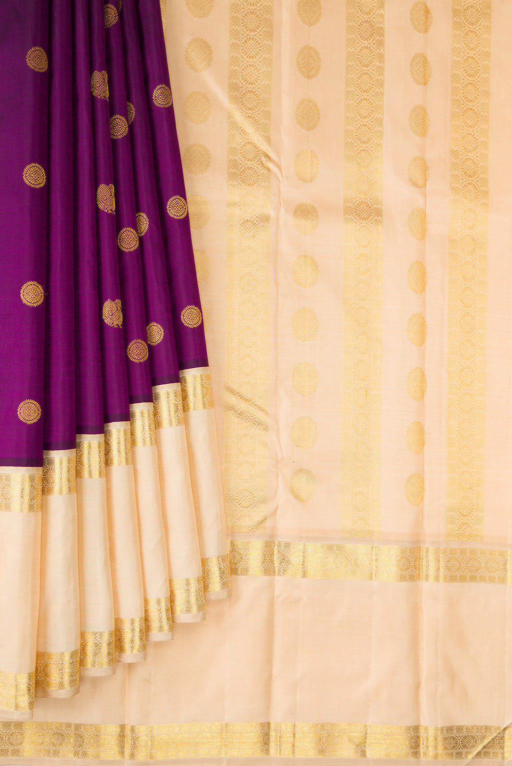 Pleats and pallu of Pure Silk Purple Kanchipuram Saree with Zari Butta on the body and Zari Border. 