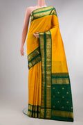 Pure Silk Yellow Kanchipuram Saree with Zari Butta on the body and Zari Border.  displayed on a mannequin