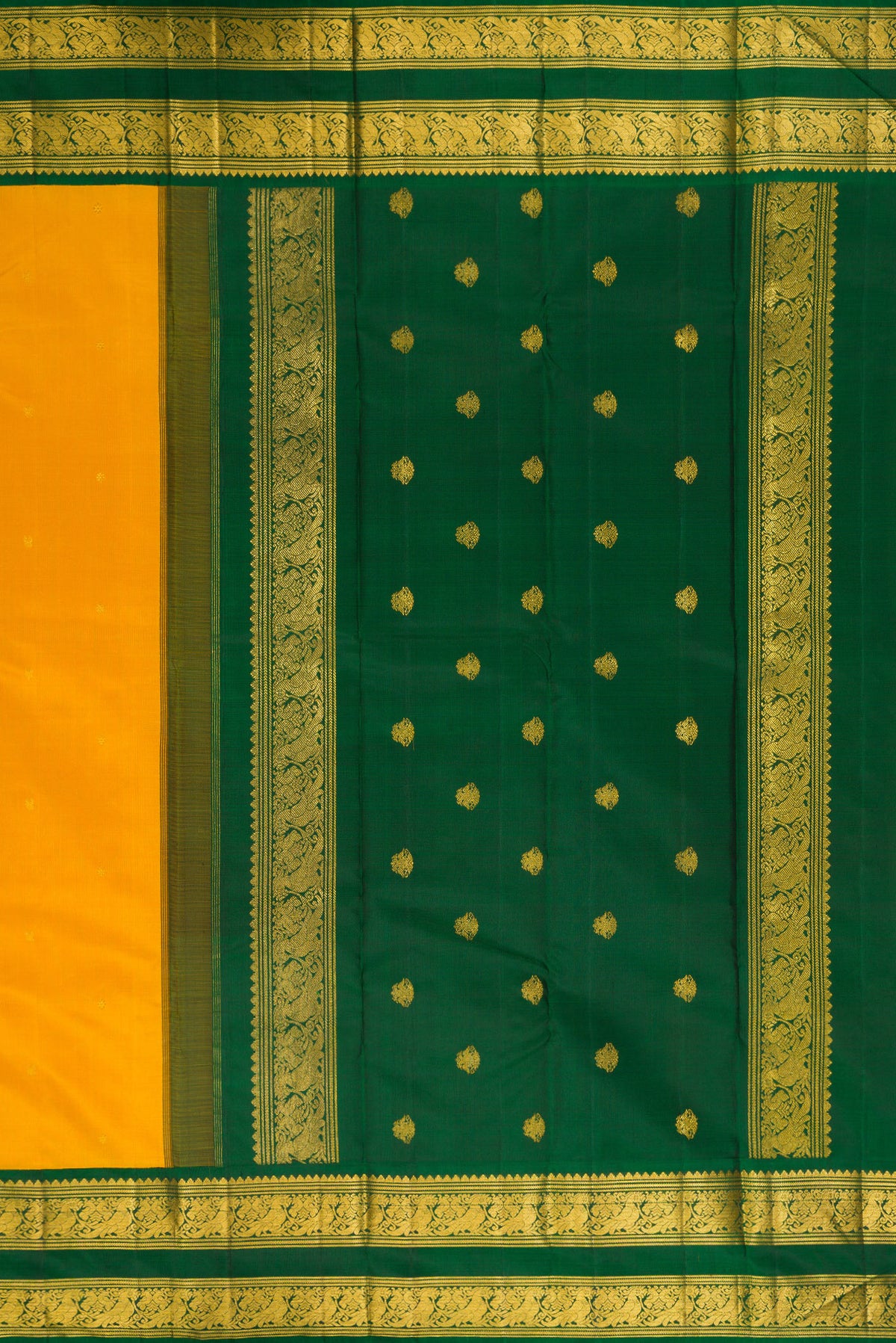 Close up image of the pallu of Pure Silk Yellow Kanchipuram Saree with Zari Butta on the body and Zari Border. 
