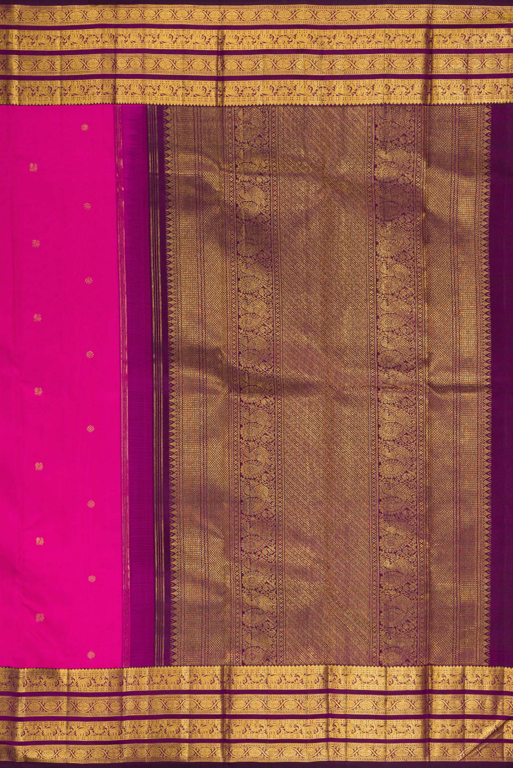 Close up image of the pallu of Pure Silk Rani Pink Kanchipuram Saree with Zari Butta on the body and Zari Border. 