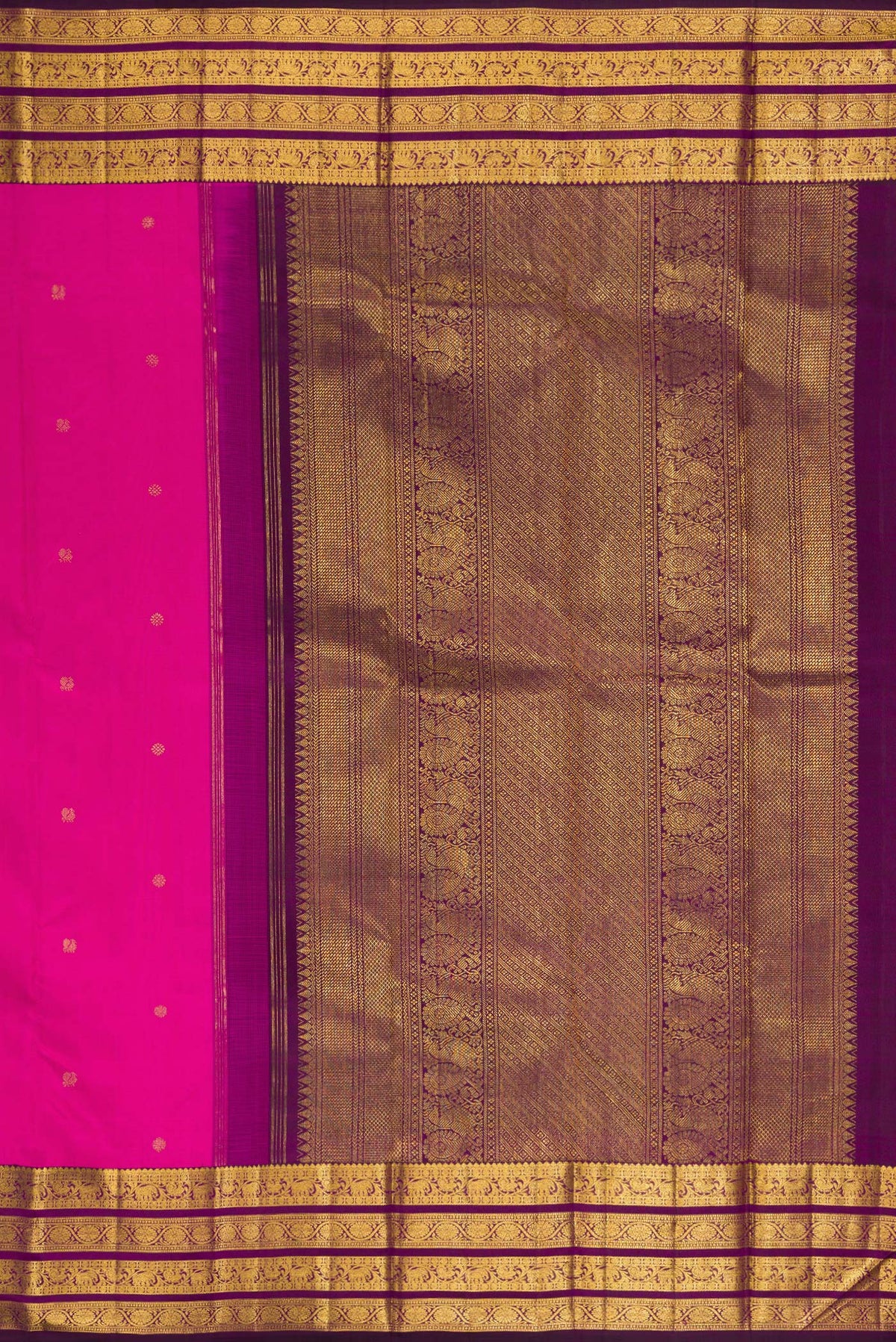 Close up image of the pallu of Pure Silk Rani Pink Kanchipuram Saree with Zari Butta on the body and Zari Border. 