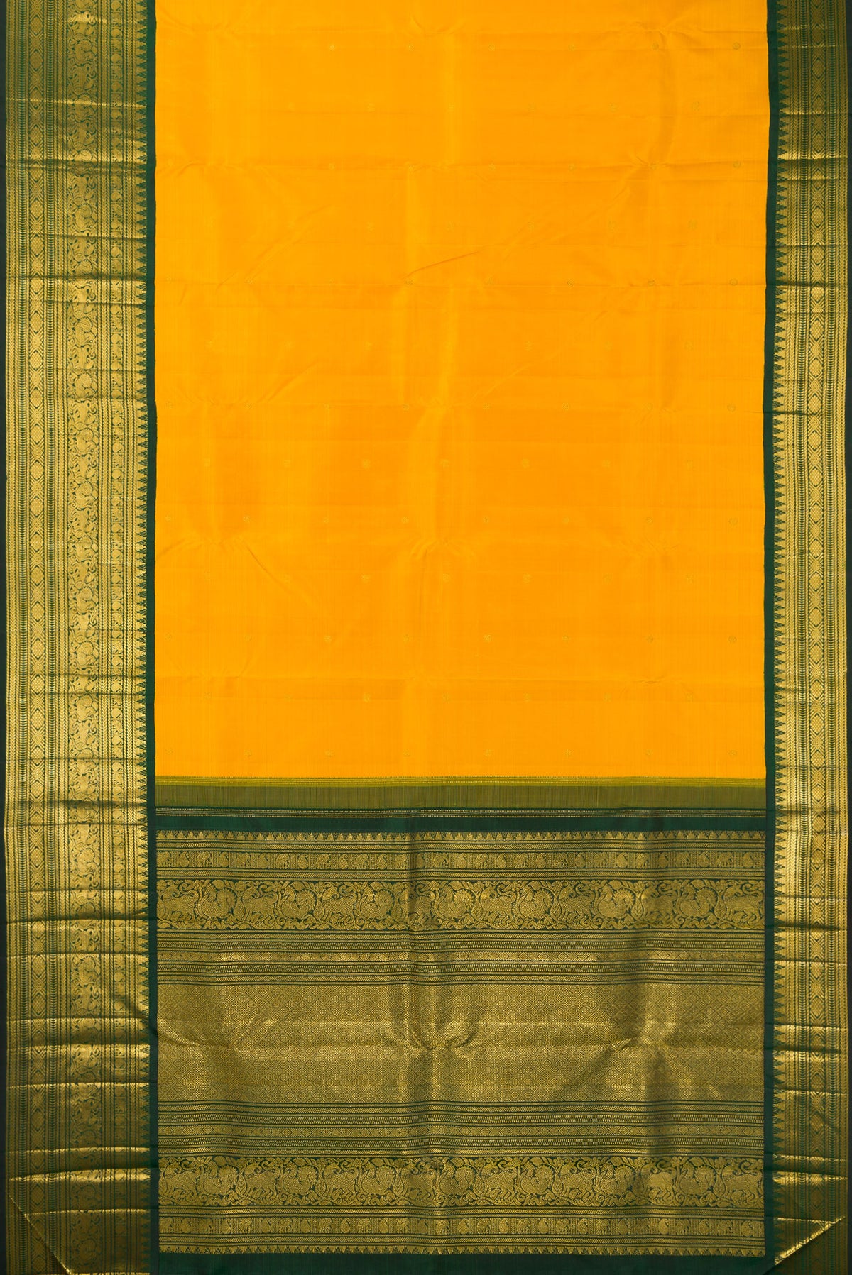 Flat view of Pure Silk Mustard Kanchipuram Saree with Zari Butta on the body and Fancy Border. 