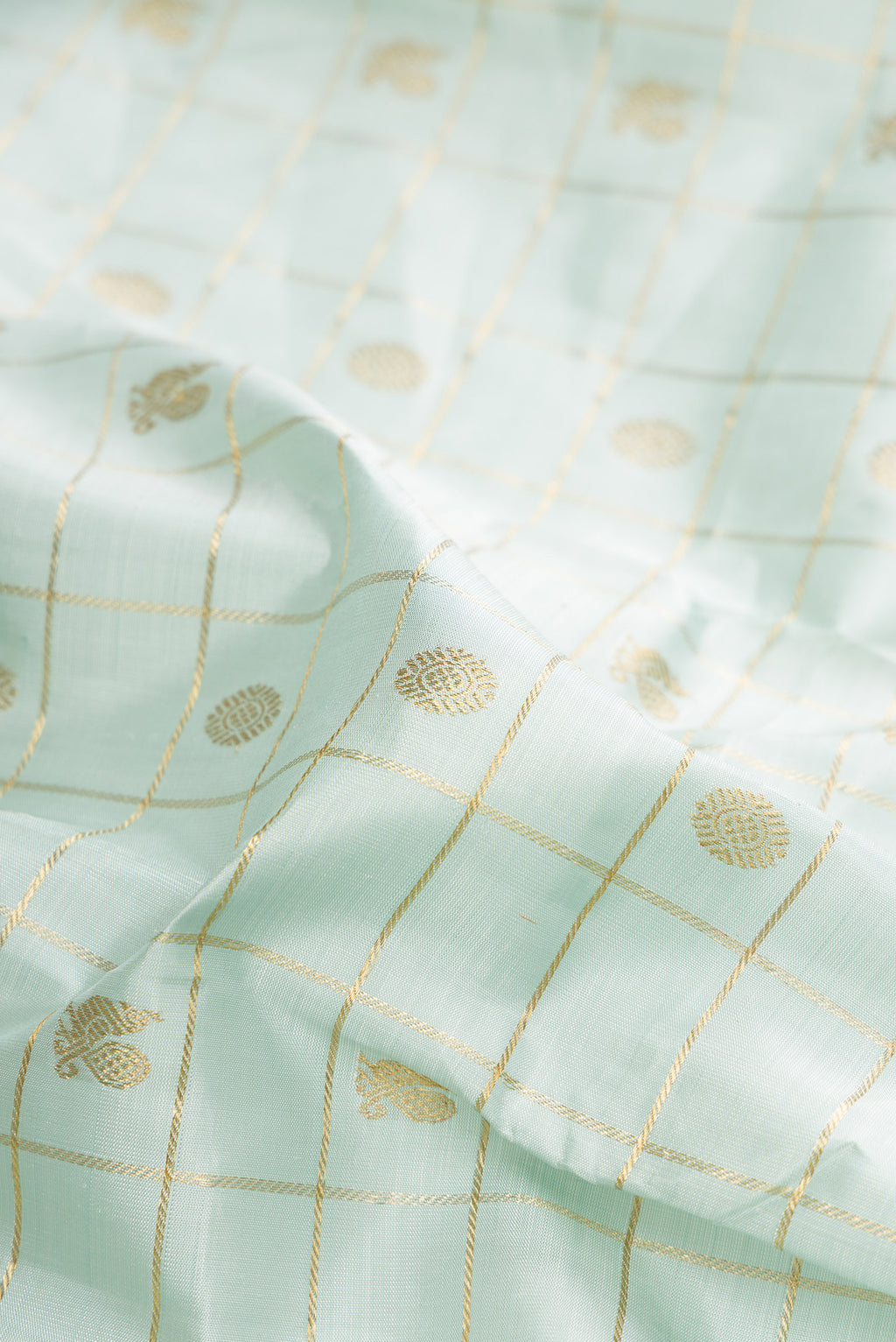 Close up of Pure Silk Light Blue Dual Tone Kanchipuram Saree with Veldhari on the body and Fancy Border.  displaying folds