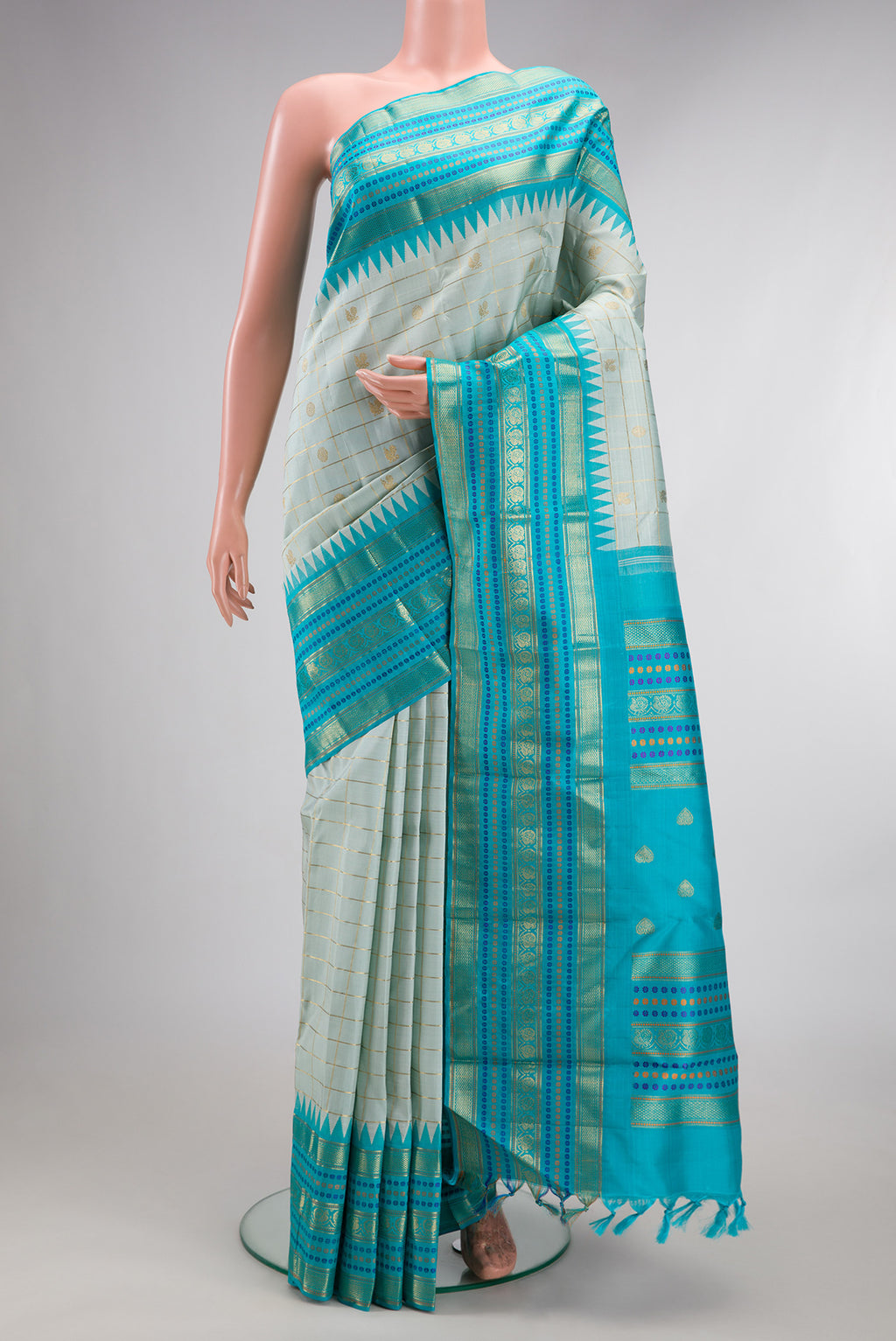Pure Silk Light Blue Dual Tone Kanchipuram Saree with Veldhari on the body and Fancy Border.  displayed on a mannequin