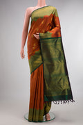 Pure Silk Rust Kanchipuram Saree with Zari Butta on the body and Fancy Border.  displayed on a mannequin