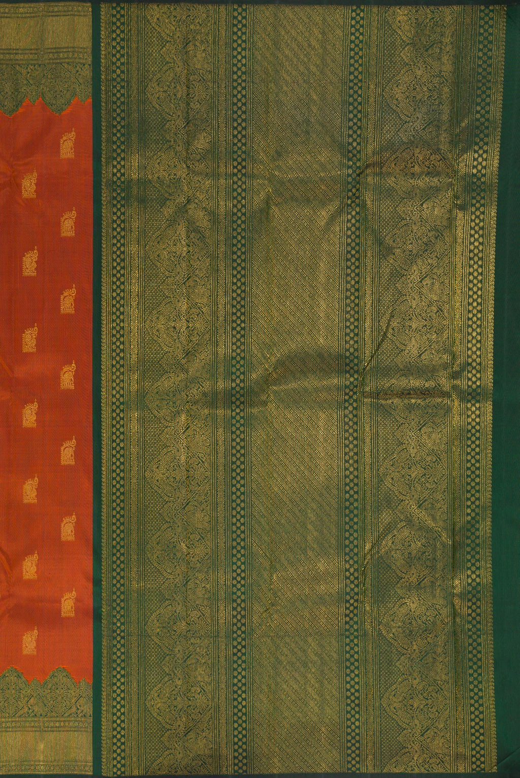 Close up image of the pallu of Pure Silk Rust Kanchipuram Saree with Zari Butta on the body and Fancy Border. 
