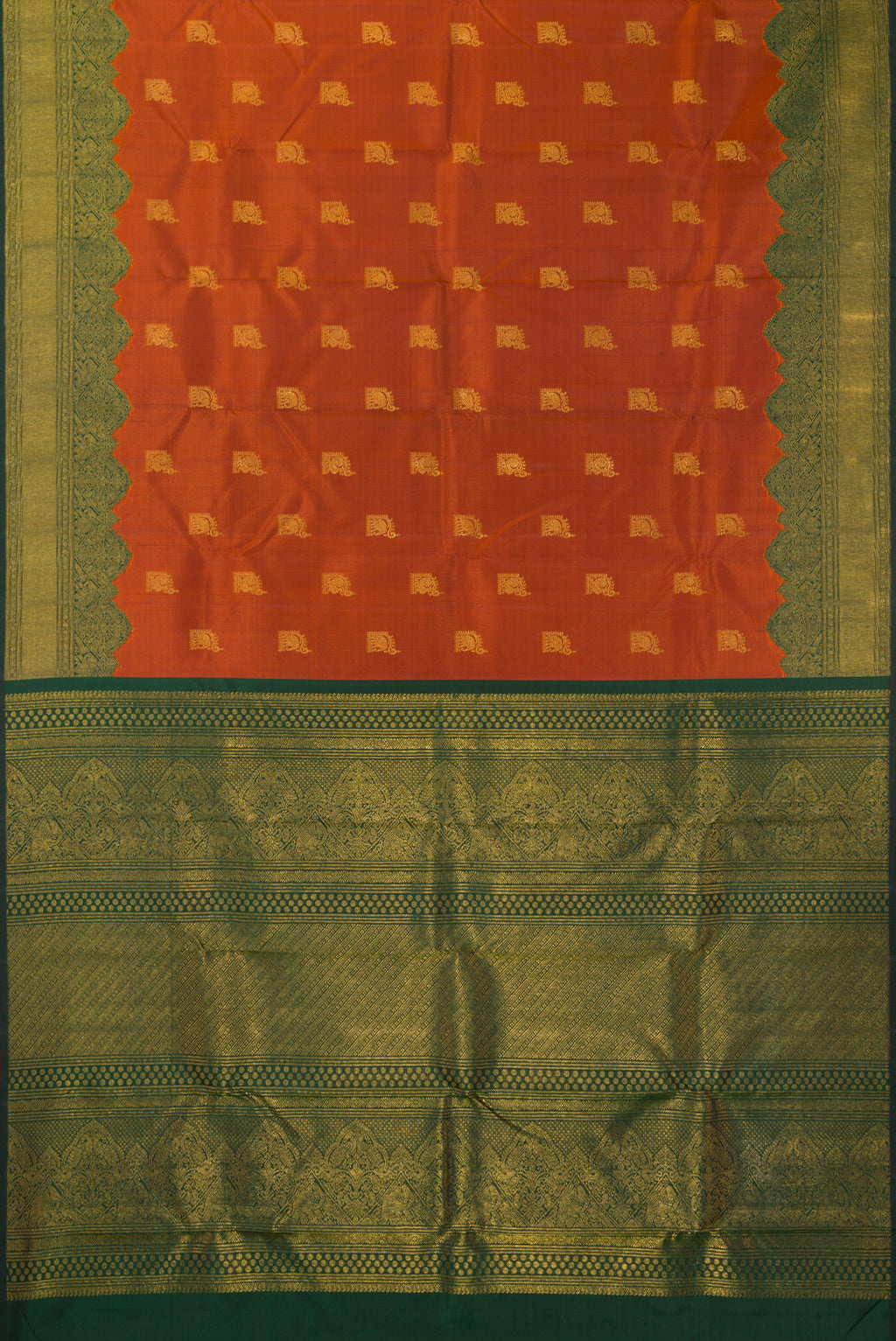 Flat view of Pure Silk Rust Kanchipuram Saree with Zari Butta on the body and Fancy Border. 