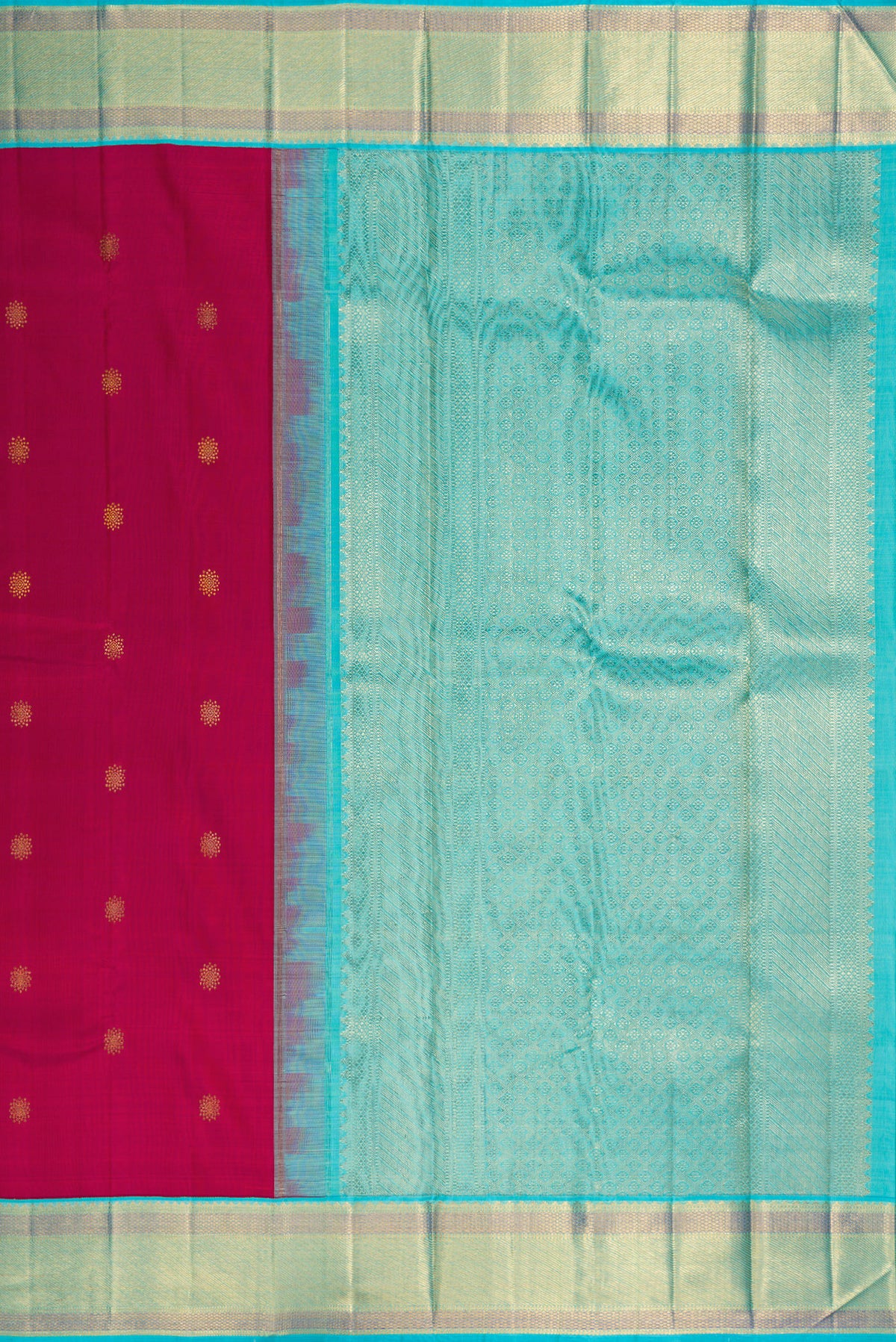 Close up image of the pallu of Pure Silk Dark Pink Kanchipuram Saree with Zari Butta on the body and Zari Border. 