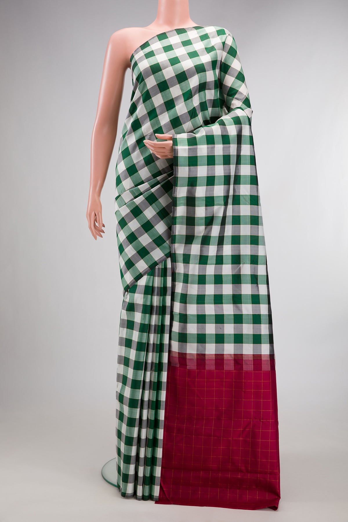 Pure Silk Multi Color Kanchipuram Saree with Checked design on the body and Without Border.  displayed on a mannequin