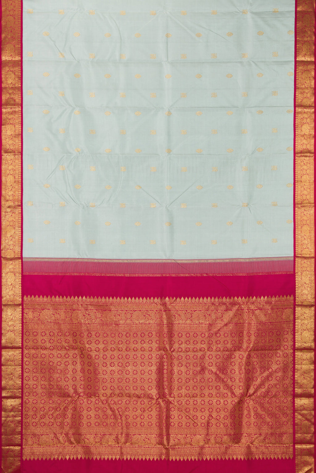 Flat view of Pure Silk Light Blue Kanjivaram Saree with Zari Butta on the body and Zari Border. 