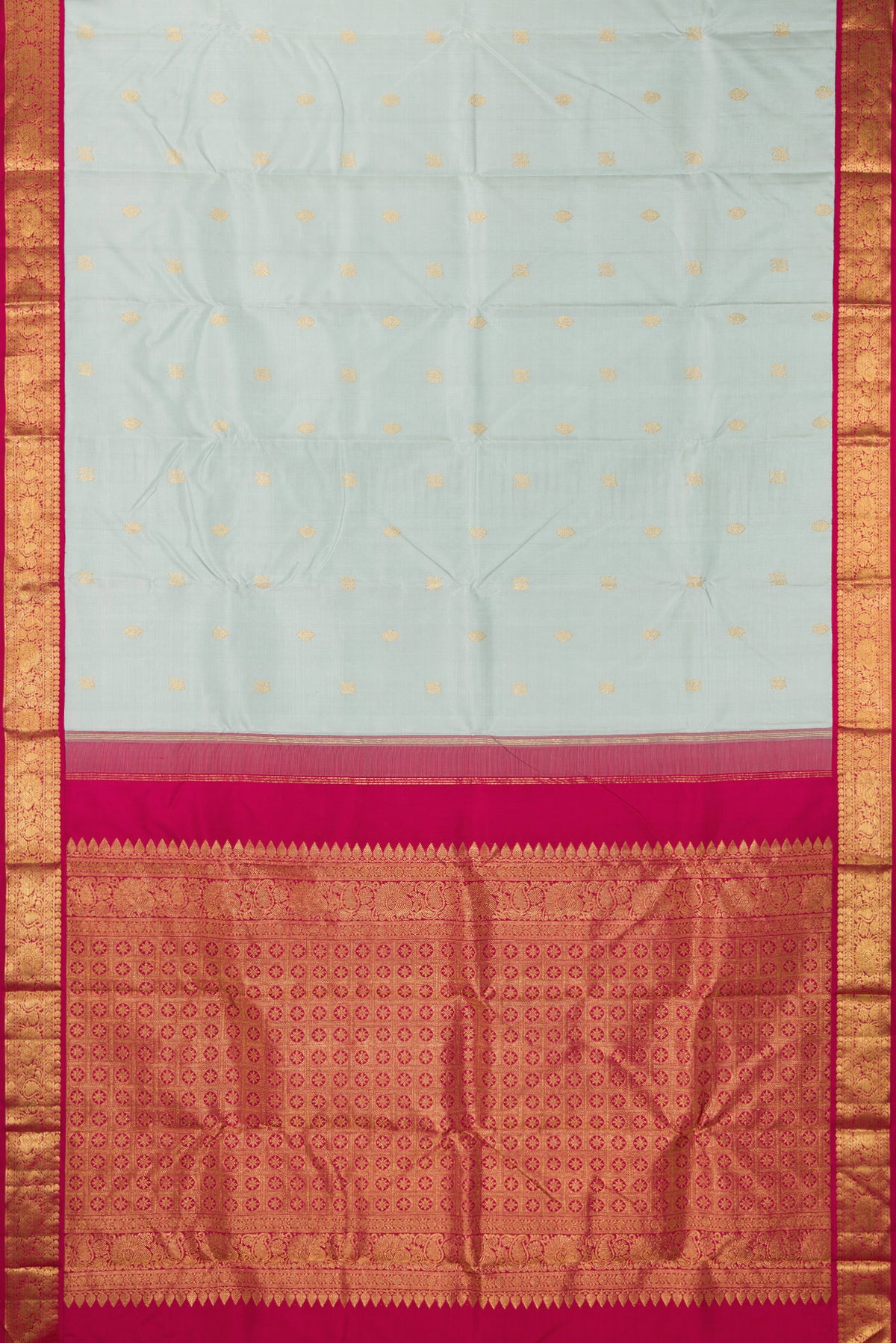 Flat view of Pure Silk Light Blue Kanjivaram Saree with Zari Butta on the body and Zari Border. 