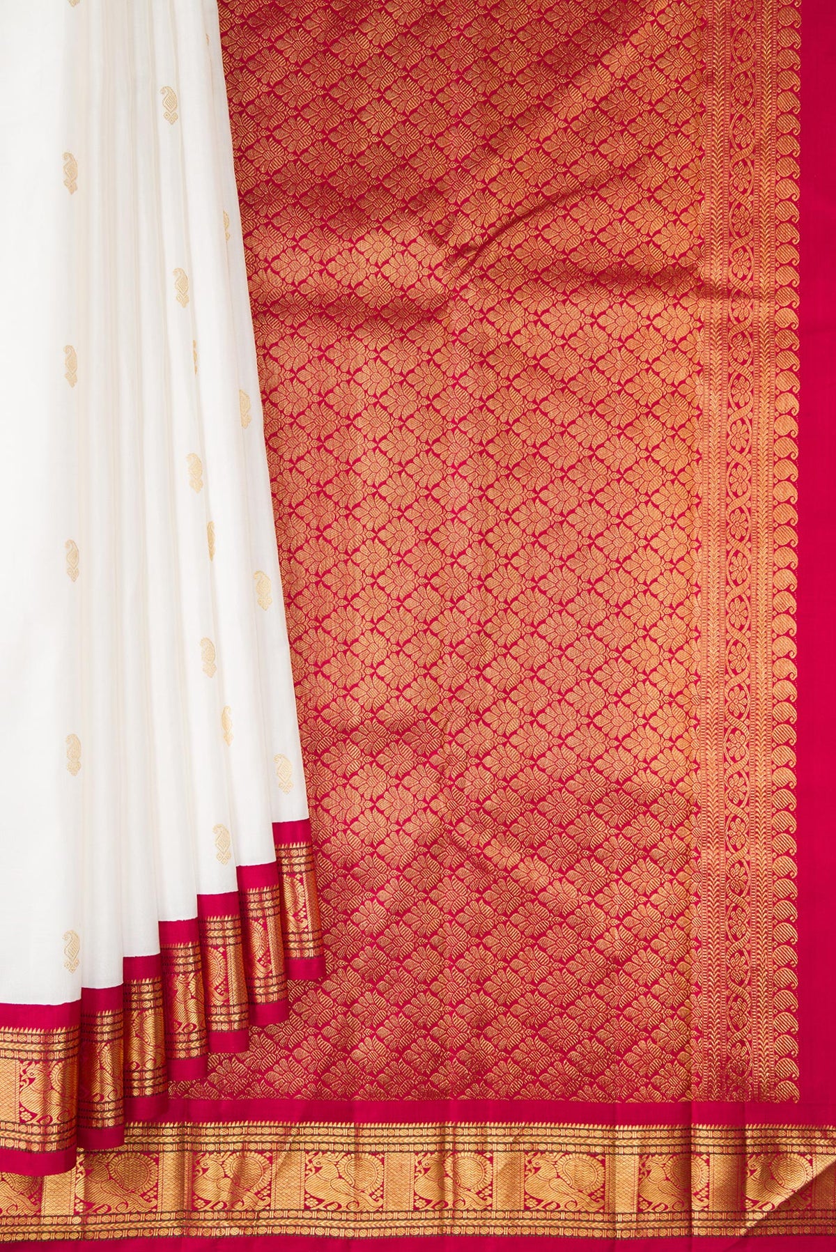 Pleats and pallu of Pure Silk White Kanjivaram Saree with Zari Butta on the body and Zari Border. 