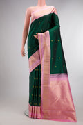 Pure Silk Bottle Green Kanchipuram Saree with Zari Butta on the body and Zari Border.  displayed on a mannequin