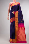 Pure Silk Navy Blue Kanjivaram Saree with Zari Butta on the body and Zari Border.  displayed on a mannequin