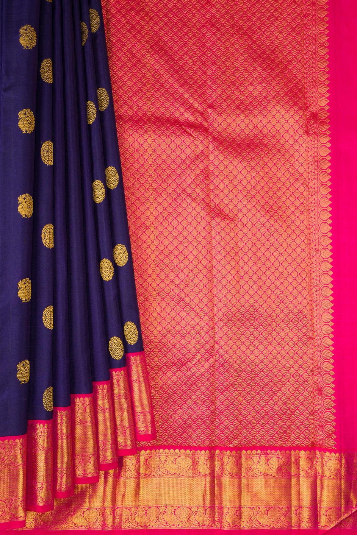 Pleats and pallu of Pure Silk Navy Blue Kanjivaram Saree with Zari Butta on the body and Zari Border. 