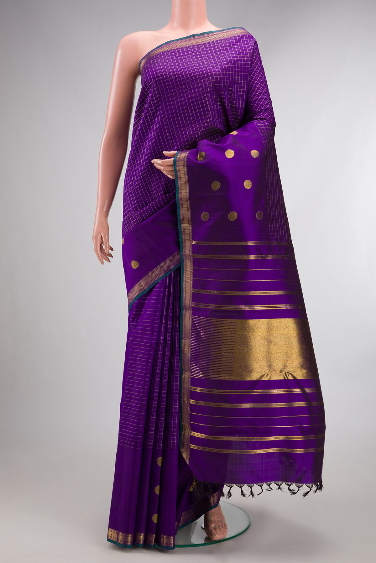 Pure Silk Pure Zari Violet Kanchipuram Saree with Checked design on the body and Fancy Border.  displayed on a mannequin