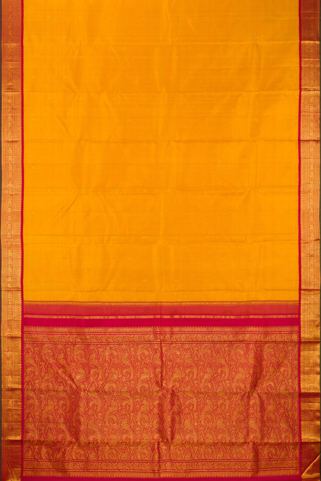 Flat view of Pure Silk Mustard Kanjivaram Saree with Zari Butta on the body and Zari Border. 