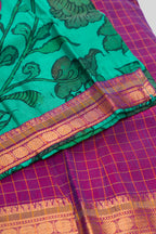 Detailed shot of Green Readymade Cotton Pavadai Set with Zari Butta on the body and Zari Border