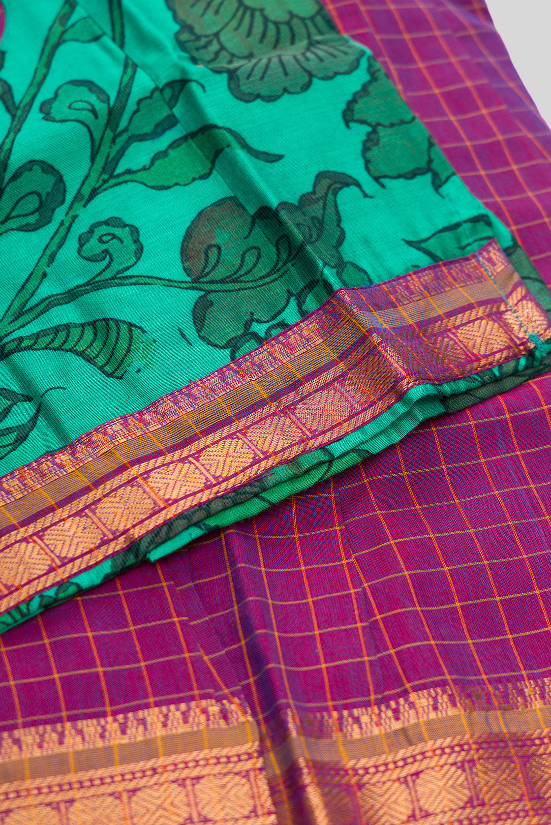 Detailed shot of Green Readymade Cotton Pavadai Set with Zari Butta on the body and Zari Border