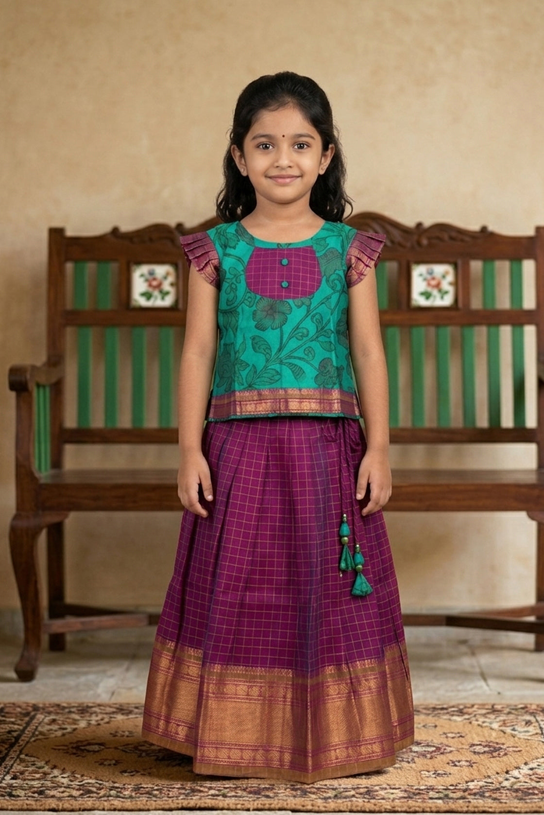 Green Readymade Cotton Pavadai Set with Zari Butta on the body and Zari Border displayed on a mannequin