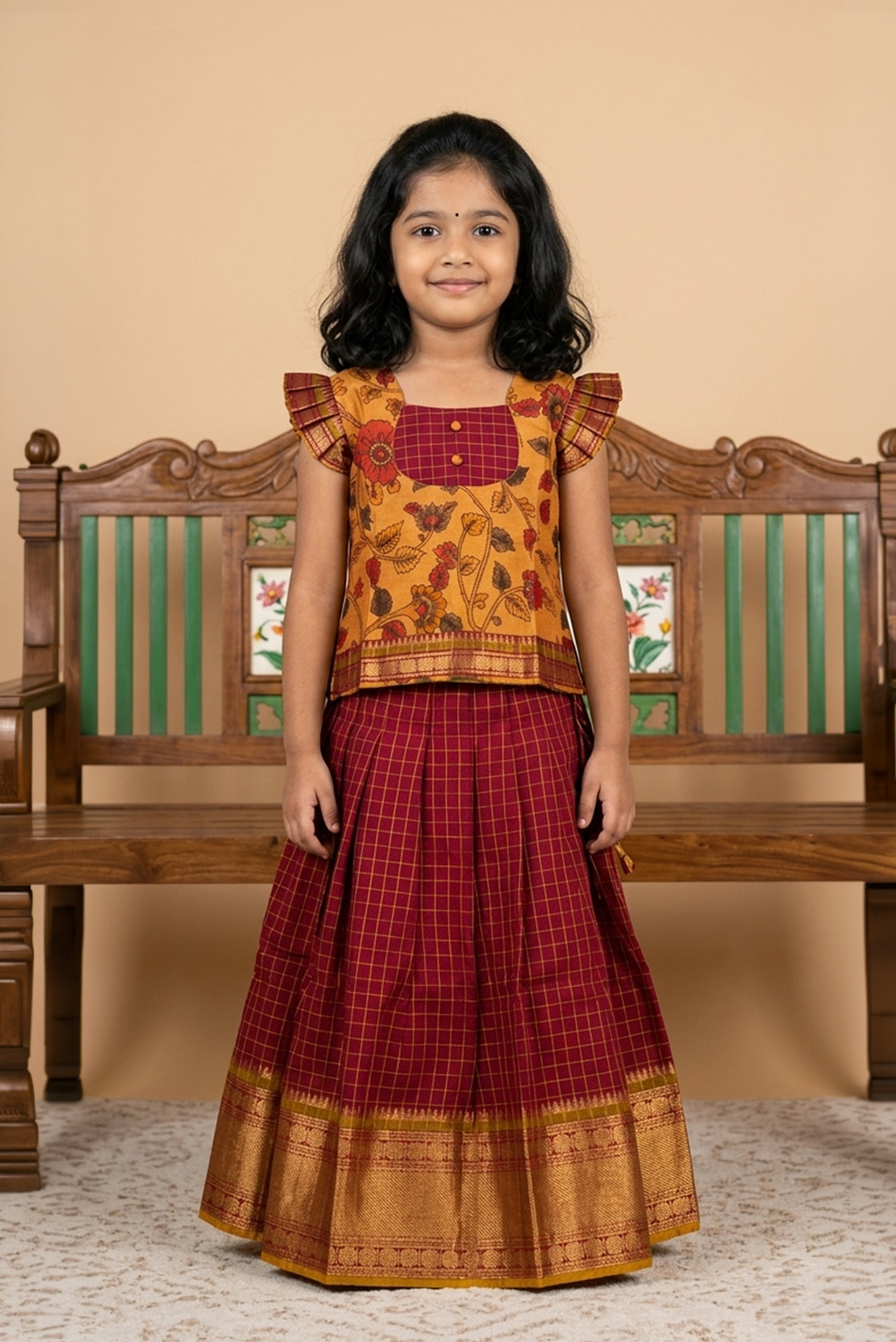 Mustard Readymade Cotton Pavadai Set with Zari Butta on the body and Zari Border displayed on a mannequin