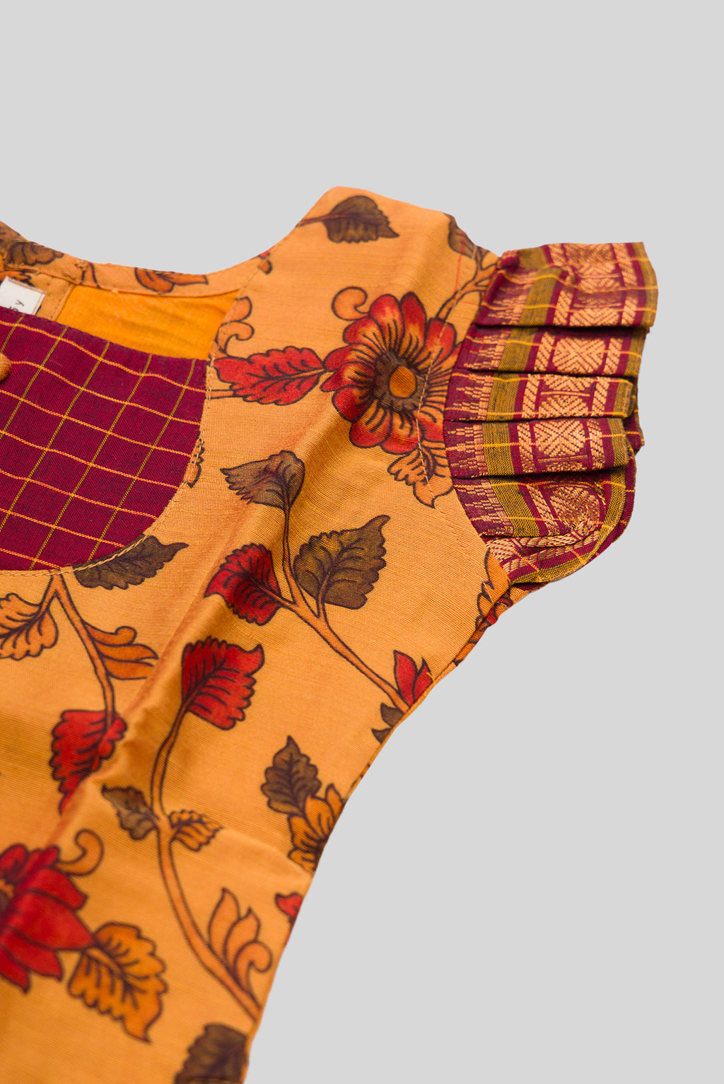 Close up sleeve details of Mustard Readymade Cotton Pavadai Set with Zari Butta on the body and Zari Border
