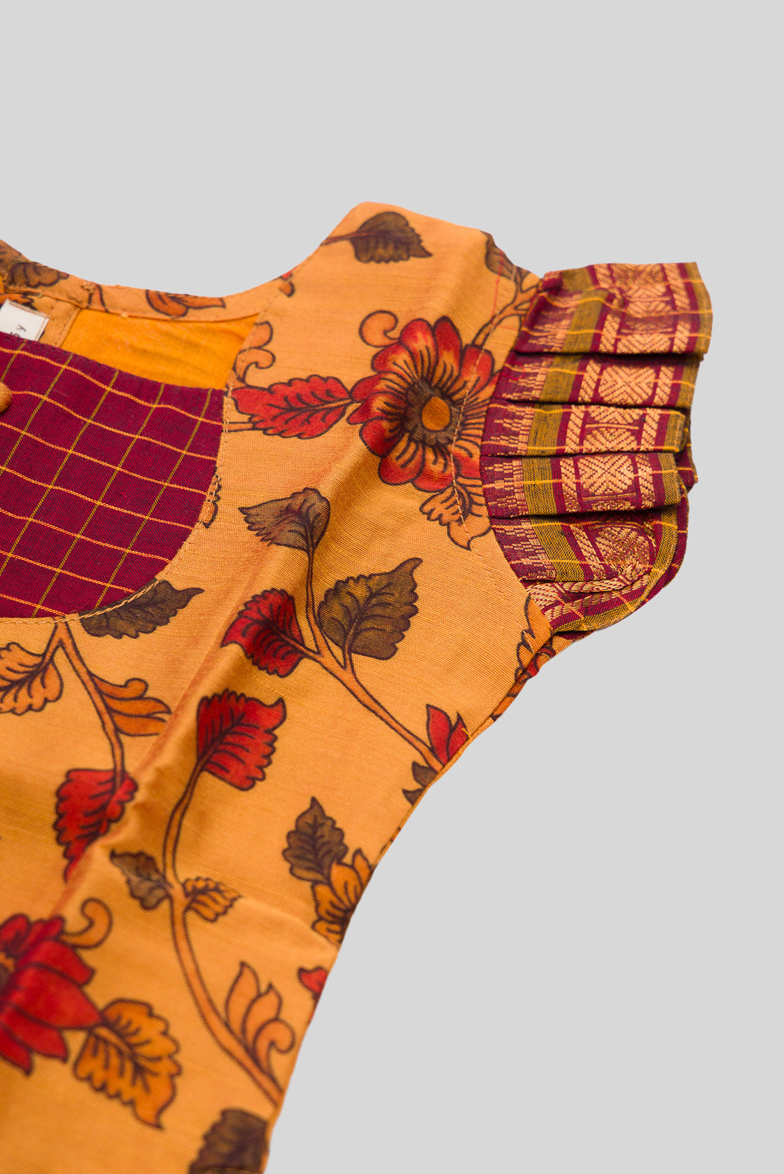 Close up sleeve details of Mustard Readymade Cotton Pavadai Set with Zari Butta on the body and Zari Border