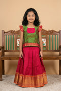 Green Readymade Cotton Pavadai Set with Zari Butta on the body and Zari Border displayed on a mannequin