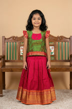 Green Readymade Cotton Pavadai Set with Zari Butta on the body and Zari Border displayed on a mannequin