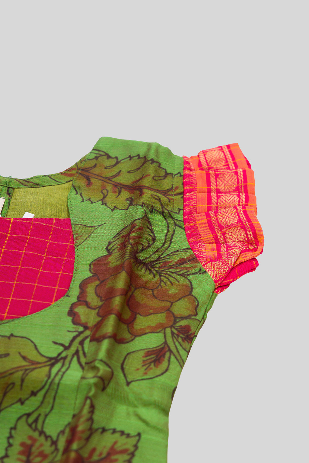 Close up sleeve details of Green Readymade Cotton Pavadai Set with Zari Butta on the body and Zari Border