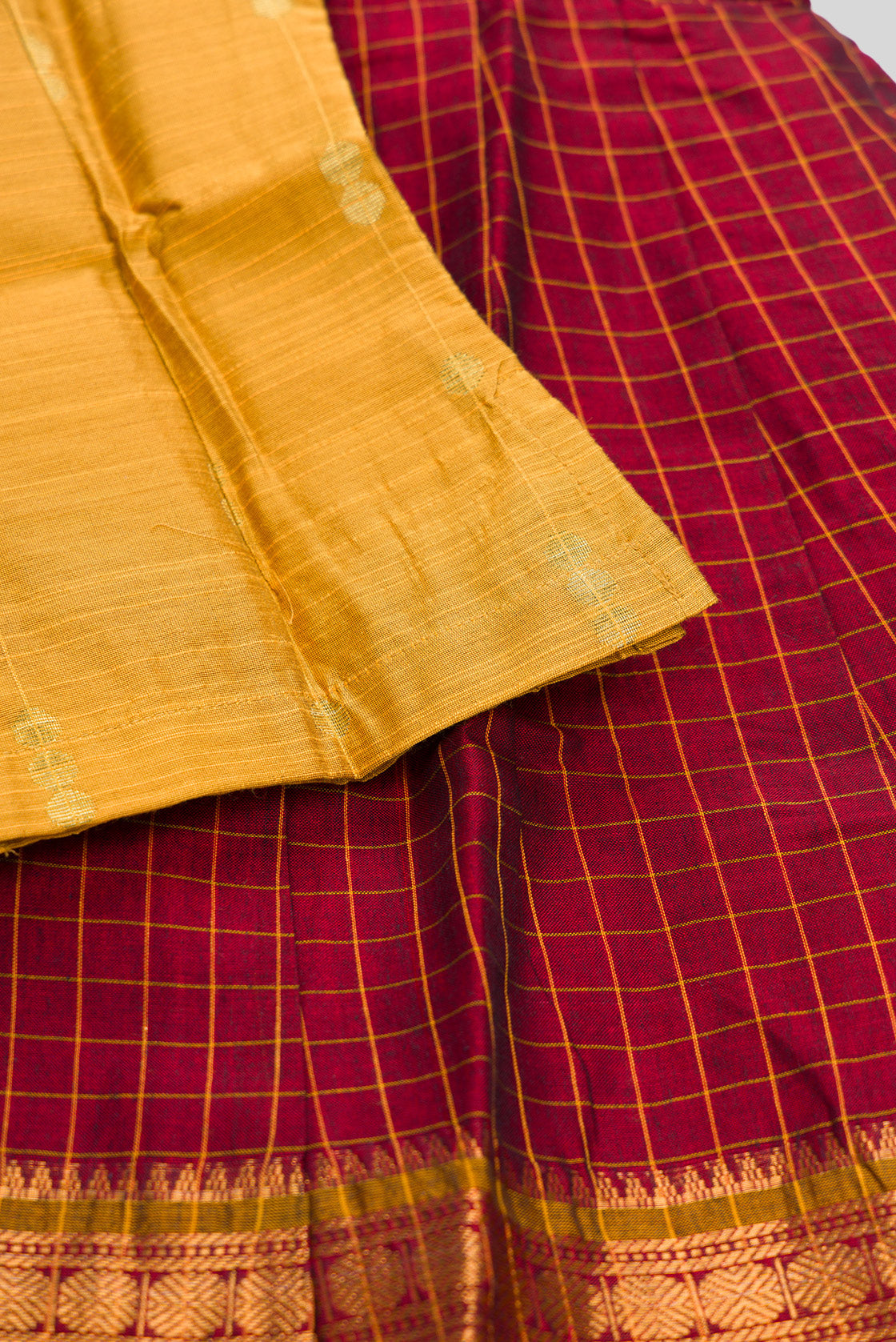 Detailed shot of Mustard Readymade Cotton Pavadai Set with Zari Butta on the body and Zari Border
