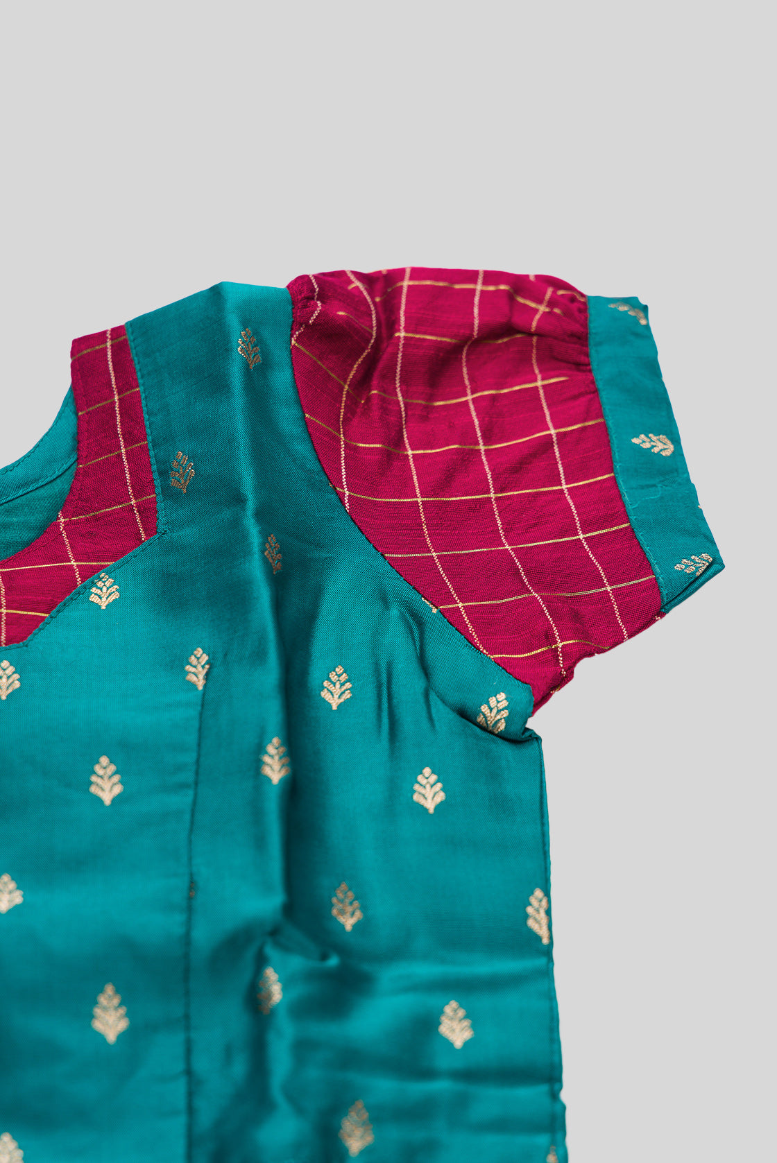 Close up sleeve details of Maya Blue Readymade Cotton Pavadai Set with Zari Butta on the body and Zari Border