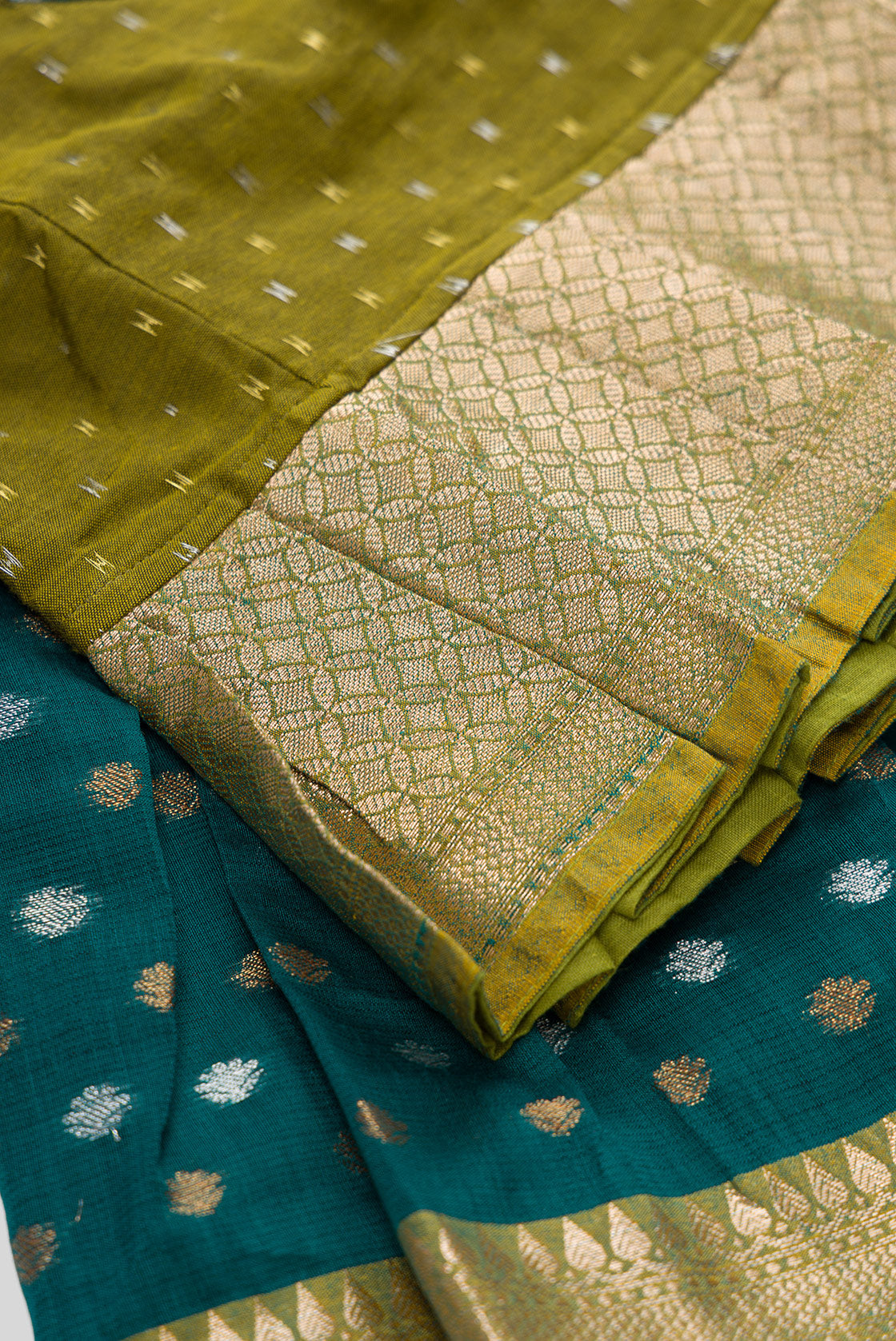 Detailed shot of Mehandi Green Readymade Cotton Pavadai Set with Zari Butta on the body and Zari Border