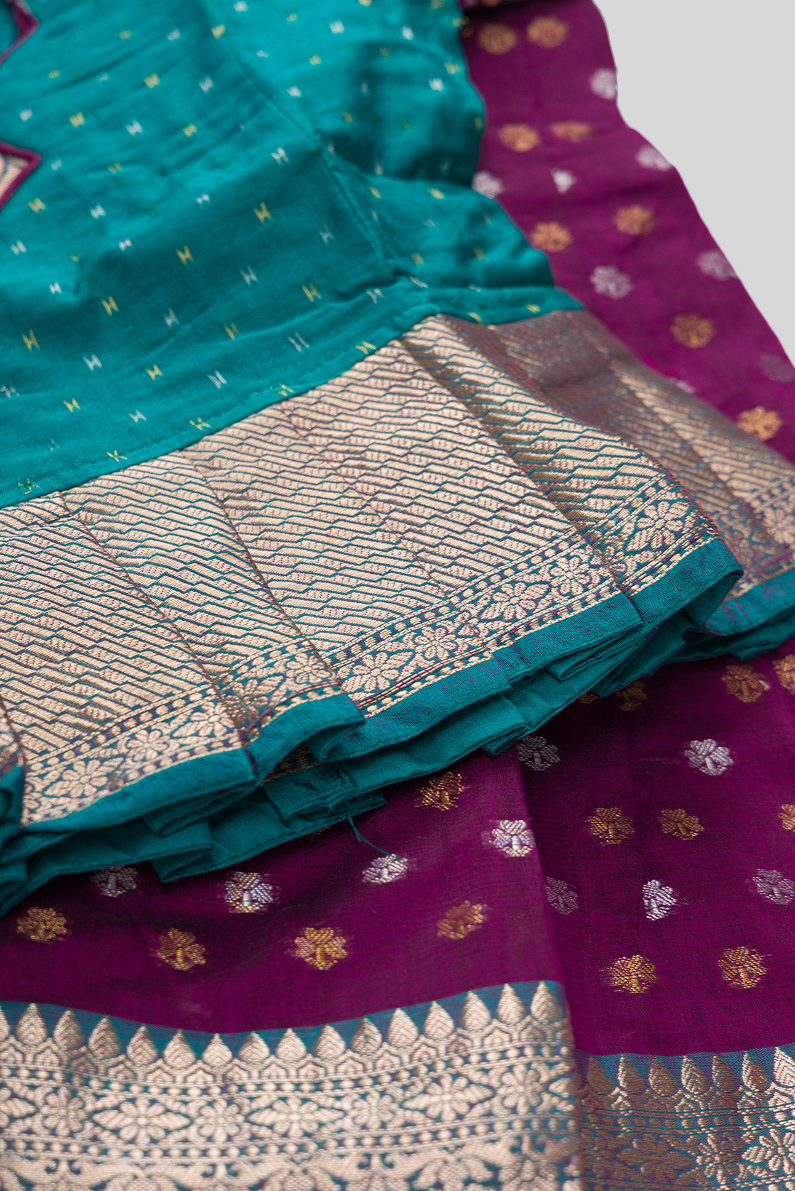 Detailed shot of Green Readymade Cotton Pavadai Set with Zari Butta on the body and Zari Border