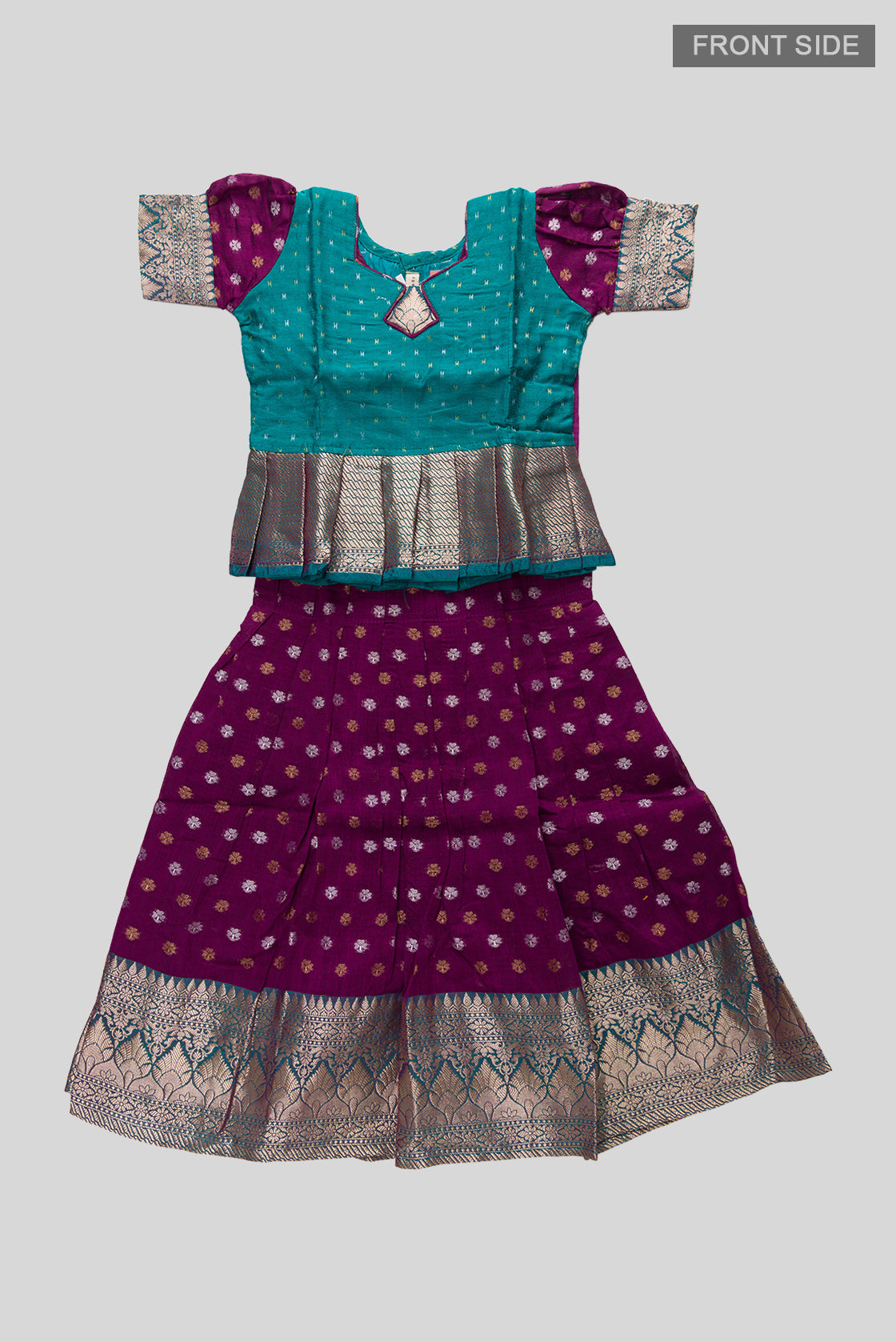 Flat lay front image of Green Readymade Cotton Pavadai Set with Zari Butta on the body and Zari Border