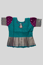 Close up blouse image of Green Readymade Cotton Pavadai Set with Zari Butta on the body and Zari Border