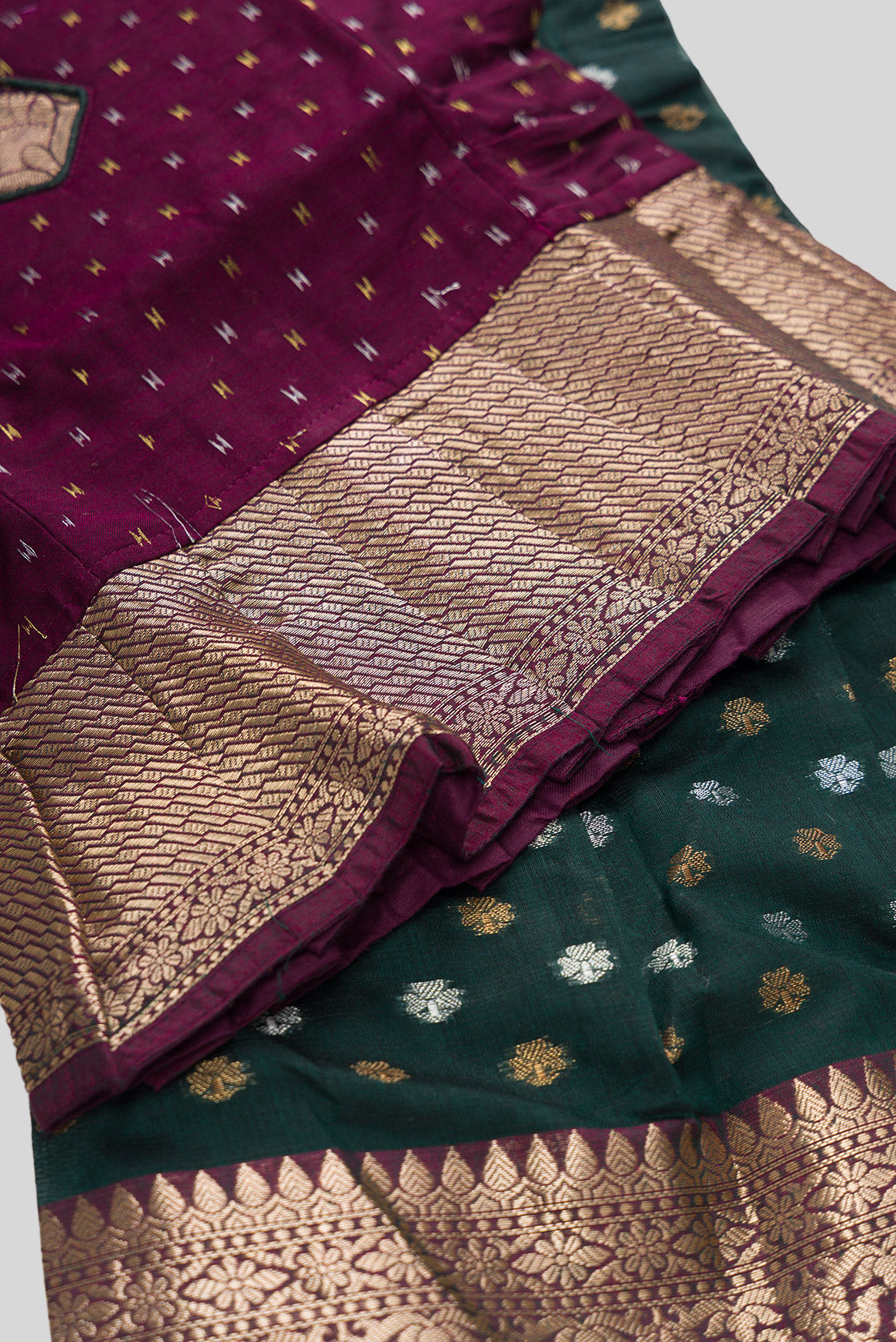 Detailed shot of Magenta Readymade Cotton Pavadai Set with Zari Butta on the body and Zari Border