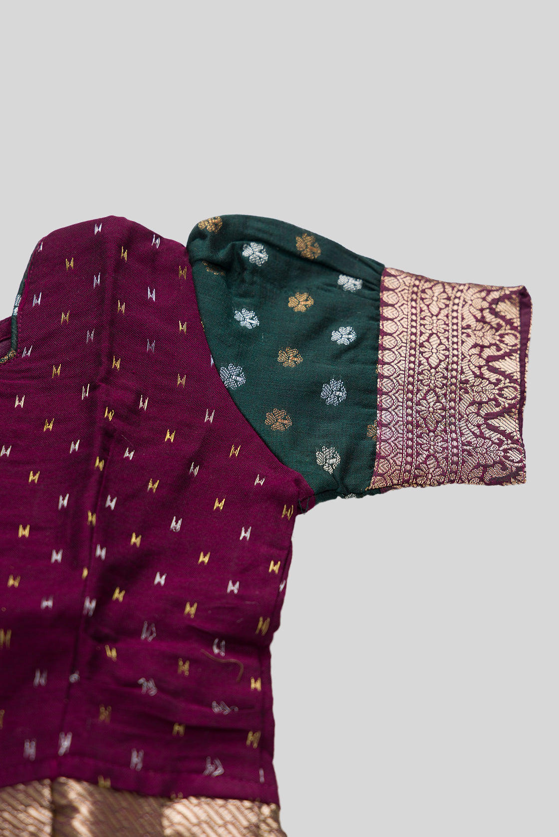 Close up sleeve details of Magenta Readymade Cotton Pavadai Set with Zari Butta on the body and Zari Border