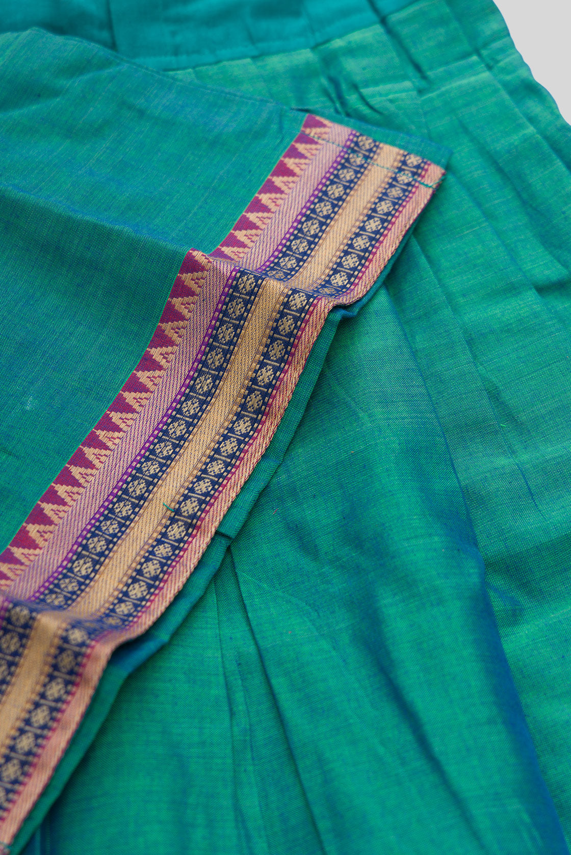 Detailed shot of Peacock Blue Readymade Cotton Pavadai Set with  on the body and Zari Border