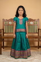 Peacock Blue Readymade Cotton Pavadai Set with  on the body and Zari Border displayed on a mannequin
