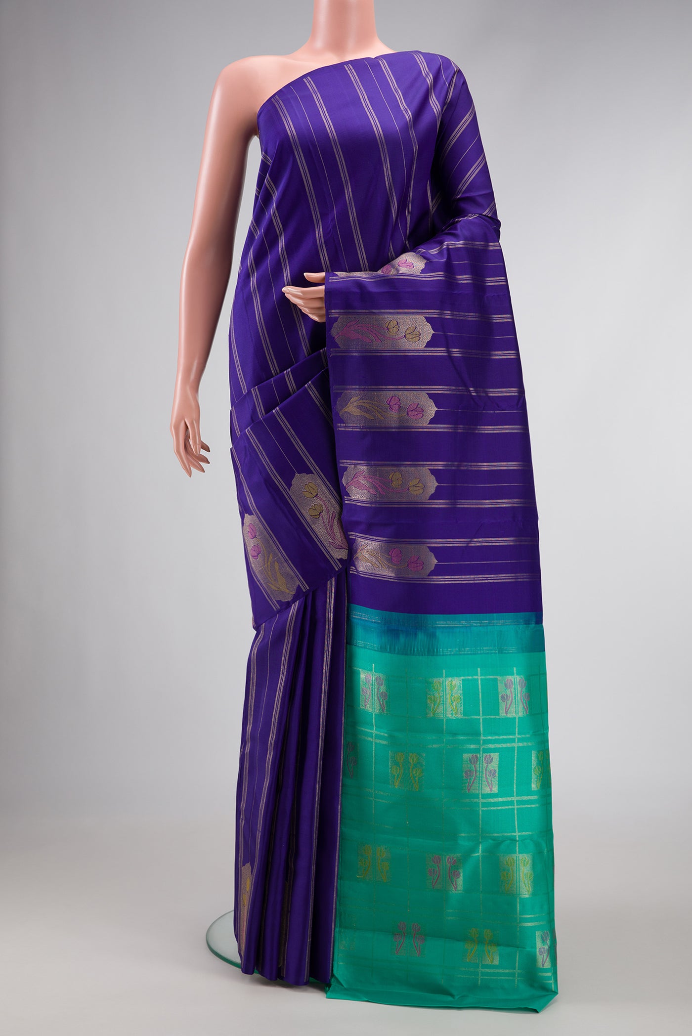 Royal Blue Dual Tone Kanjivaram Silk Saree with Stripes on the body and Fancy Border.  displayed on a mannequin