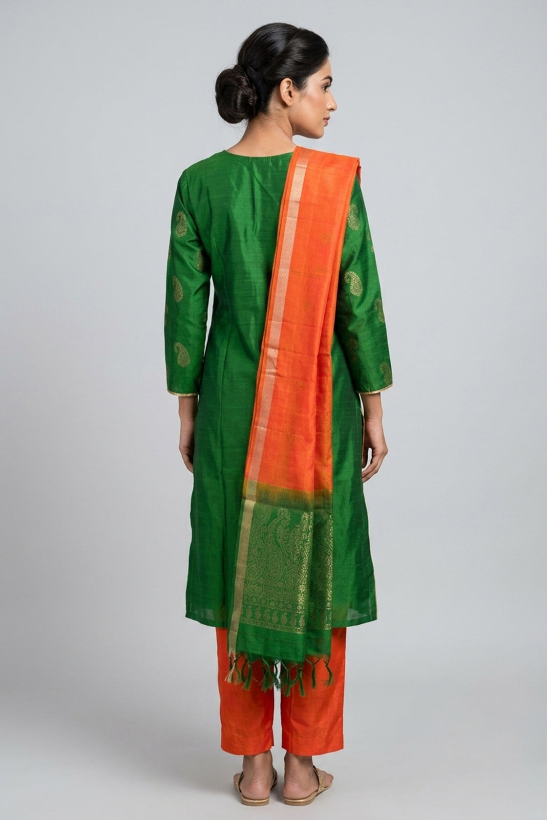 Green Pure Silk Womens Kurta set featuring Zari Butta Kurta paired with Orange Plain Body bottom and a Zari Butta dupatta in Orange back image displayed on an AI model