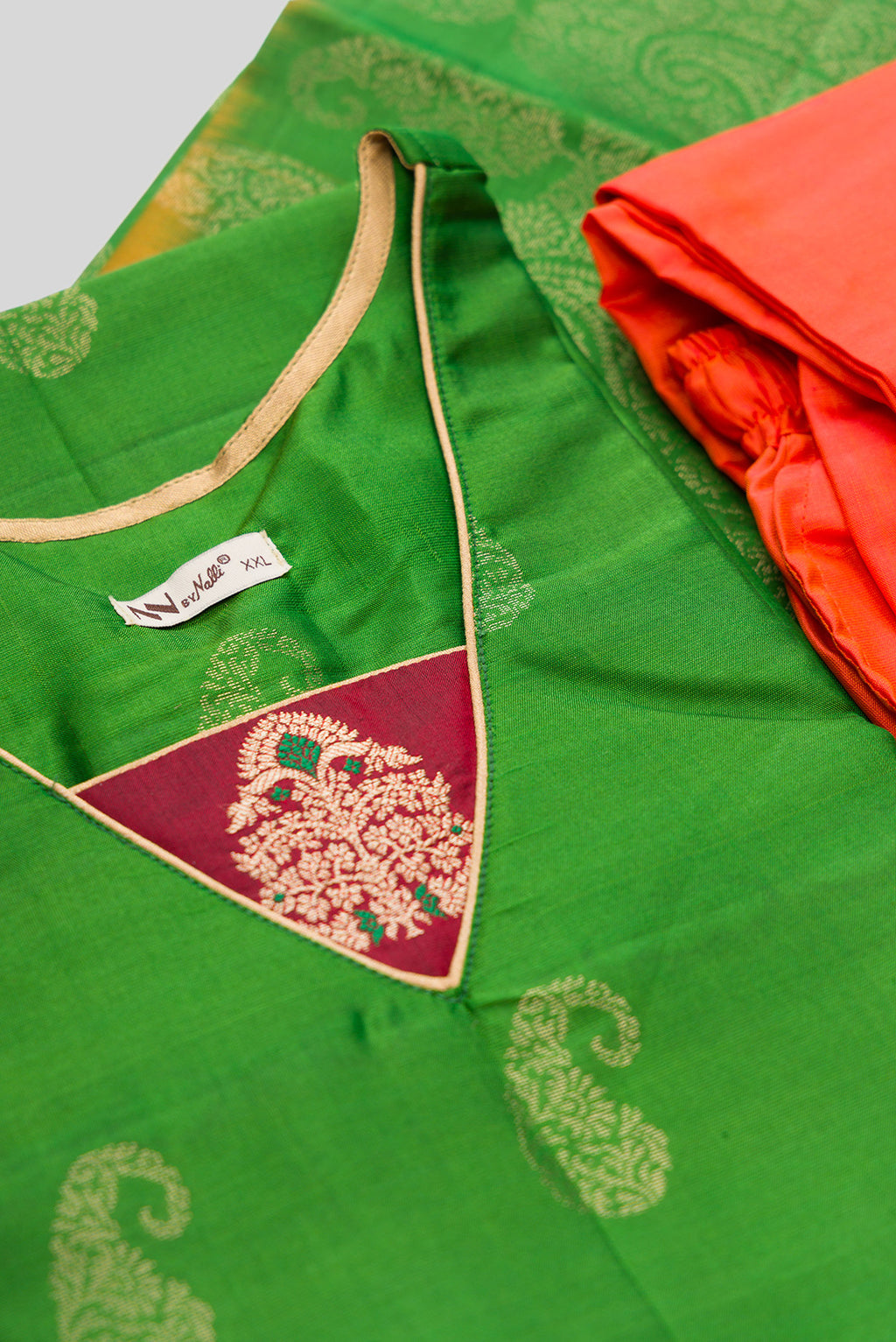 Detailed shot of Green Pure Silk Womens Kurta set featuring Zari Butta Kurta paired with Orange Plain Body bottom and a Zari Butta dupatta in Orange