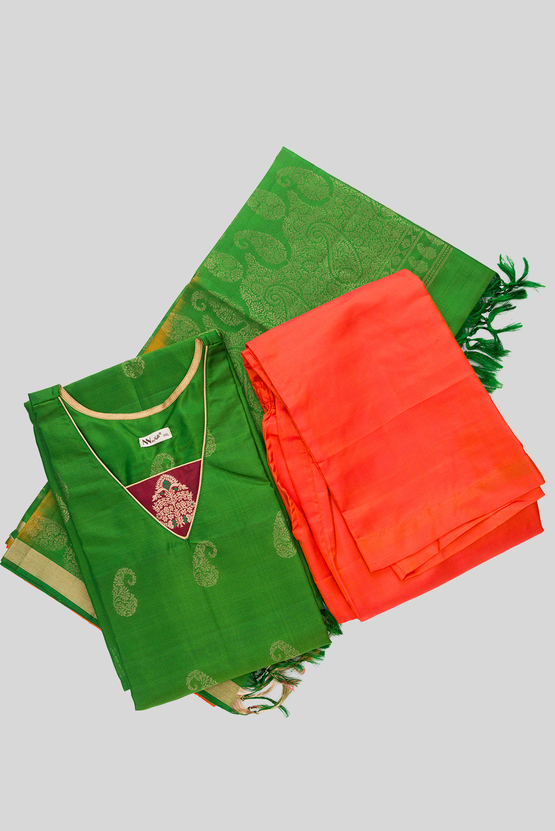 Flat lay of Green Pure Silk Womens Kurta set featuring Zari Butta Kurta paired with Orange Plain Body bottom and a Zari Butta dupatta in Orange