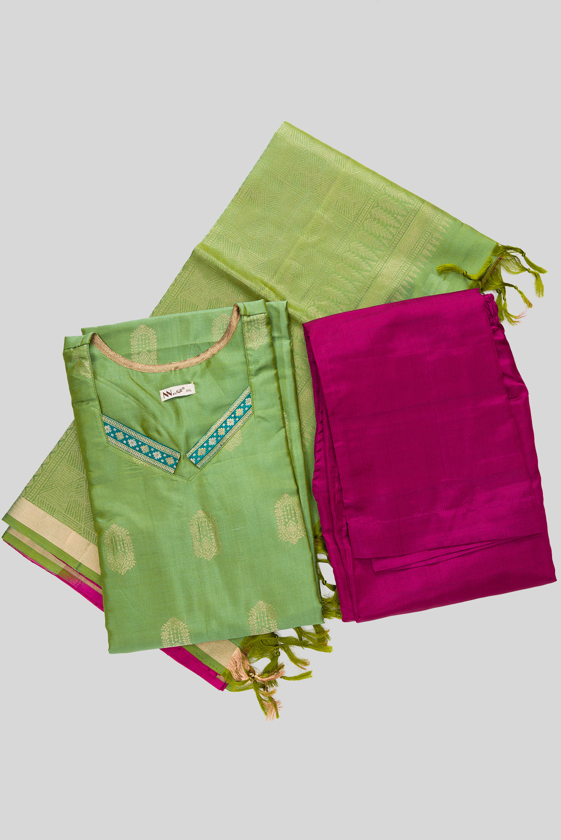 Flat lay of Green Pure Silk Womens Kurta set featuring Zari Butta Kurta paired with Magenta Plain Body bottom and a Zari Butta dupatta in Magenta