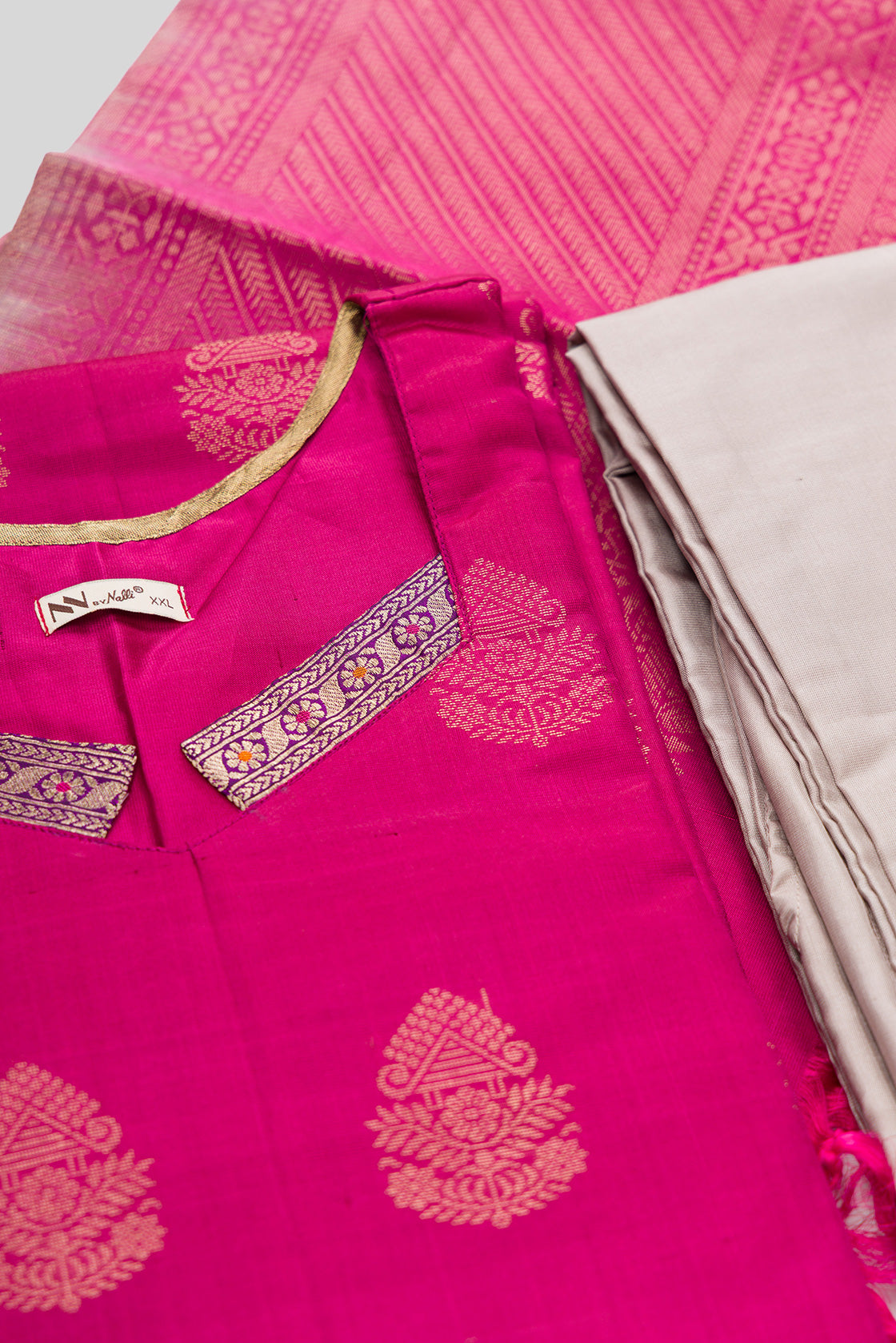 Detailed shot of Magenta Pure Silk Womens Kurta set featuring Zari Butta Kurta paired with Dark Beige Plain Body bottom and a Zari Butta dupatta in Dark Beige