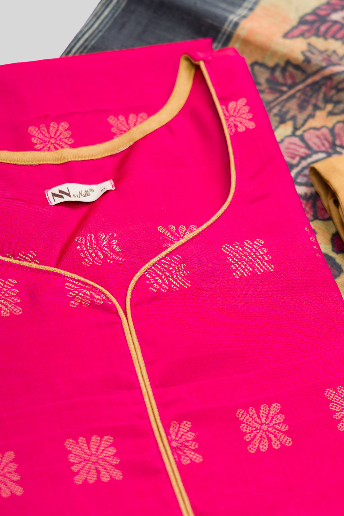 Detailed shot of Green Pure Silk Womens Kurta set featuring Zari Butta Kurta paired with Gold Plain Body bottom and a Printed dupatta in Gold
