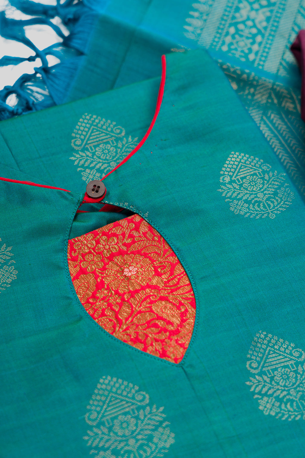 Detailed shot of Green Pure Silk Womens Kurta set featuring Zari Butta Kurta paired with Burgundy Plain Body bottom and a Zari Butta dupatta in Burgundy